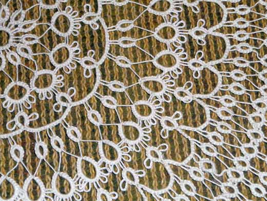 Fragment of lace tatting round doily
