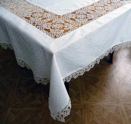 Corner of a white tablecloth with tatting lace edging and large square inserts, handmade by FairyLacefromElena, showing base knot technique