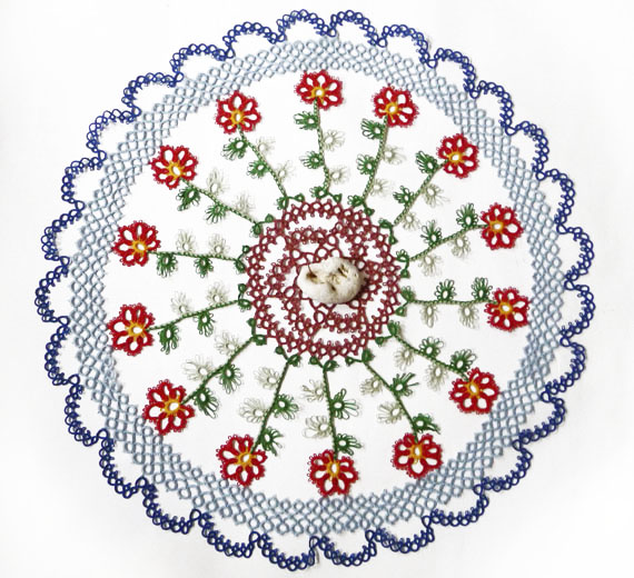 Tatting round doily with stone