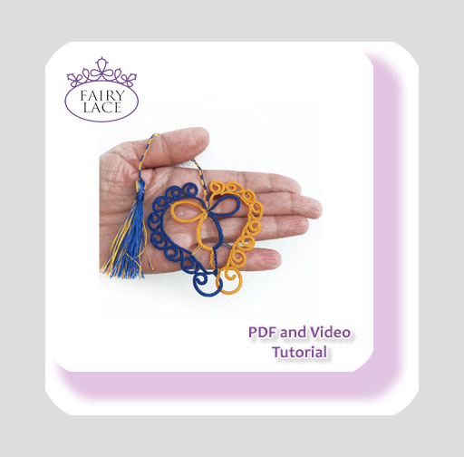 Needle tatting heart pattern in blue and yellow with tassel, held in hand – Curls of Love